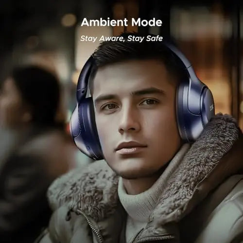 Man wearing blue wireless headphones with Ambient Mode, promoting corporate gifting from Nalanda Enterprises.
