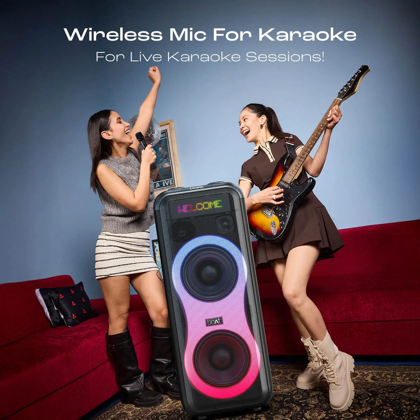 Two women enjoying karaoke with wireless mic and guitar, boat speaker, indoor party setup